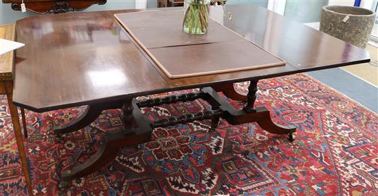 A George III style mahogany Cumberland-action drop flap table 184cm extended